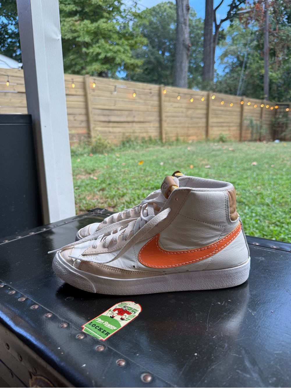 Nike White High-Top Sneakers with Orange Swoosh and Tan Accents